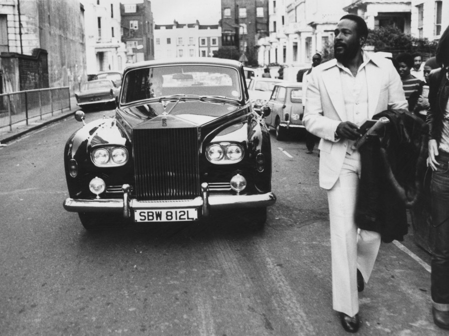 Marvin Gaye walks ahead of his Rolls Royce in Notting Hill, London, in 1976.