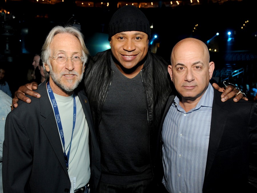 Recording Academy President and CEO Neil Portnow, host LL Cool J and Executive Vice President of Specials, Music and Live Events at CBS Entertainment Jack Sussman pose at the Staples Center in Los Angeles on Jan. 23, a few days before the 2014 Grammy Awards.