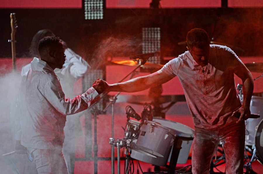 Kendrick Lamar and Dan Reynolds of Imagine Dragons onstage during the 56th Grammy Awards.