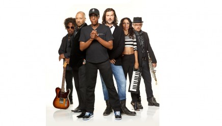 Arsenio Hall with his band. Robin DiMaggio stands to the right of Arsenio.