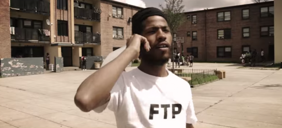 D.C. rapper Yung Gleesh turned himself into police in Austin on Tuesday after being charged with sexual assault.