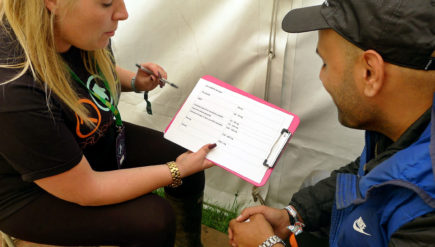 Drug counselor Gemma Bennet (left) explains to Rio Brown the results of forensic tests on a fragment of an ecstasy pill he brought in for evaluation at The Loop.